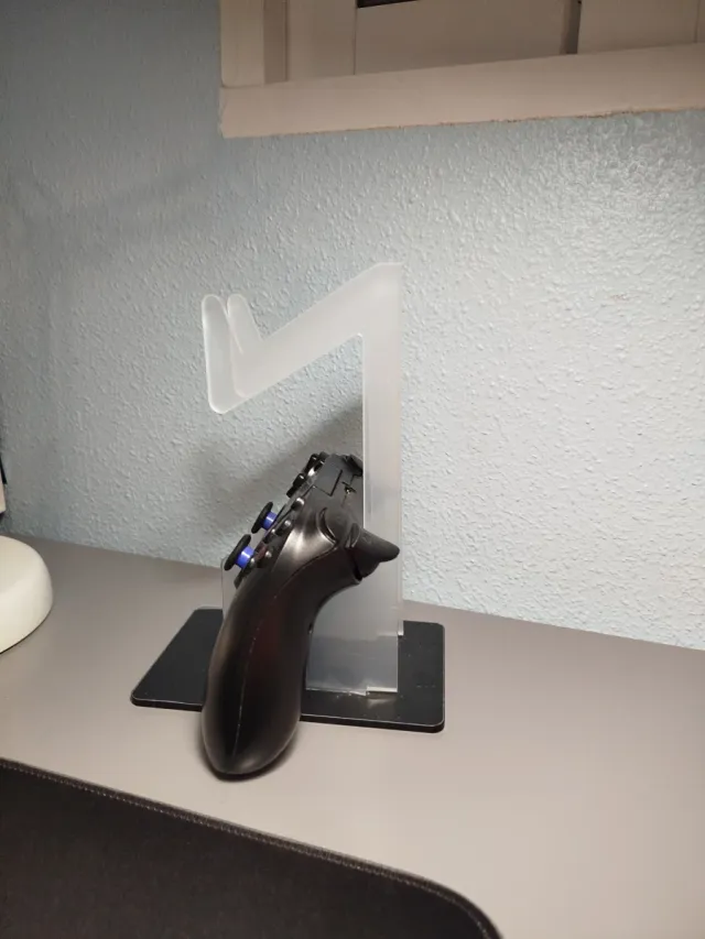 Soporte acrílico para mando de consola