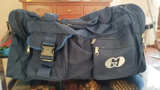Bolso de viaje azul multibolsillos