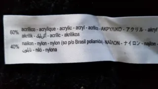 Jersey de punto corto con abalorios Talla L Zara