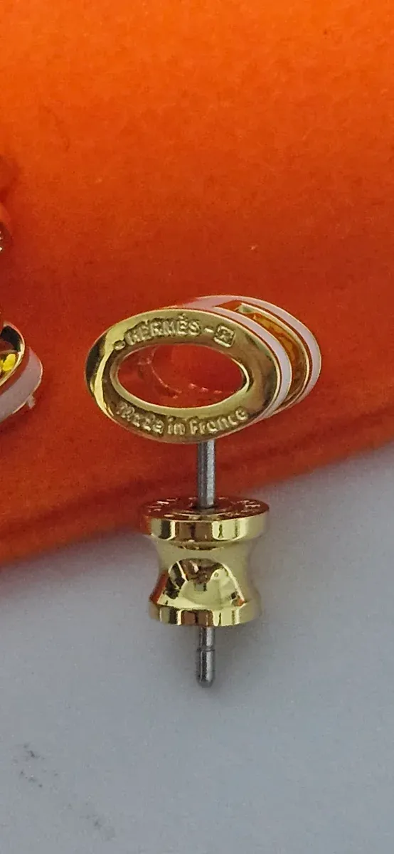 Pendientes Hermès H Dorados y Blancos