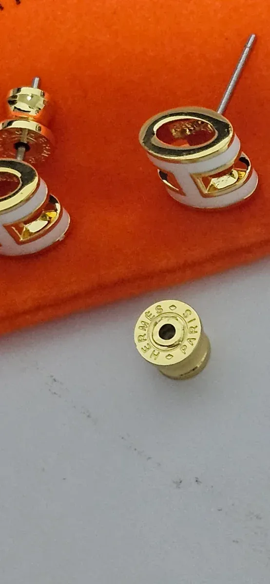 Pendientes Hermès H Dorados y Blancos