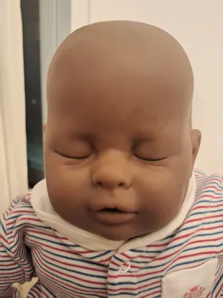 Morbida bambola neonato con giochini