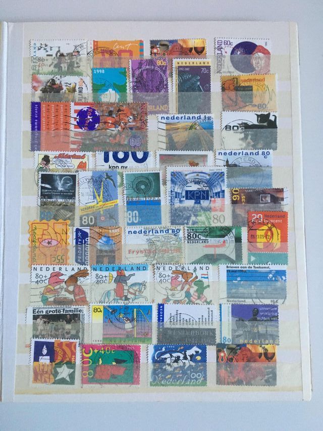 Classificatore con francobolli usati dalla Svizzera e Paesi Bassi