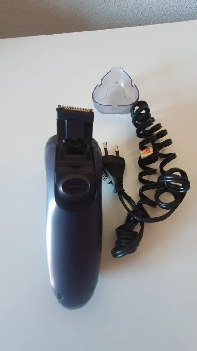 Máquina de afeitar eléctrica rotatoria