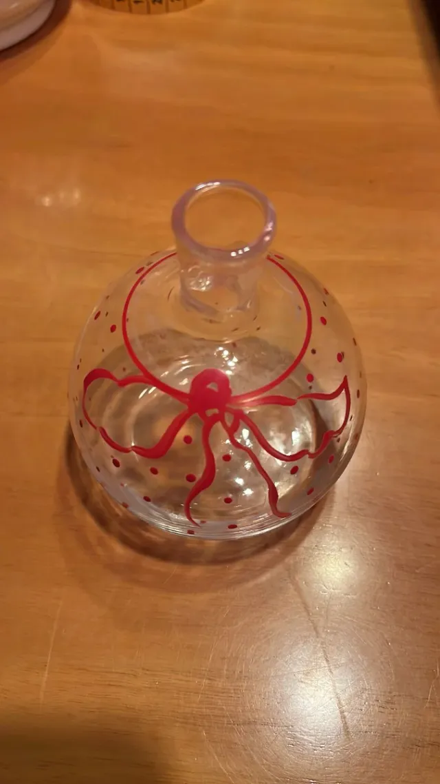 Ampolla in vetro con fiocco rosso