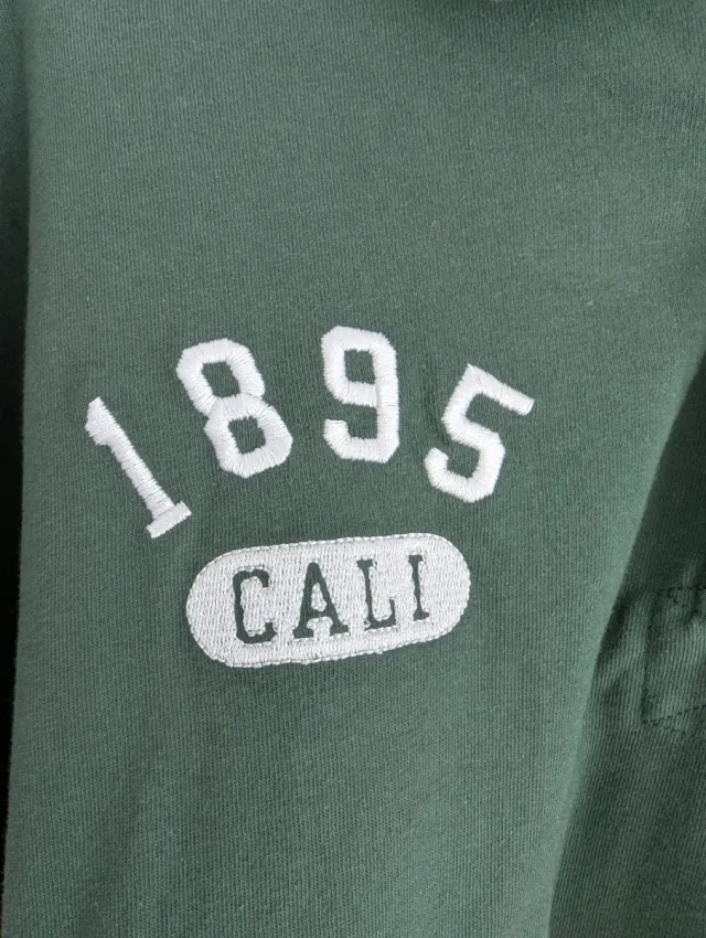 Polo manga larga verde y blanco The Stronghold