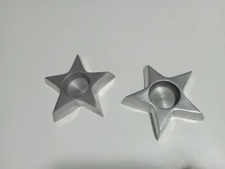 Portacandele a forma di stella in metallo argentato