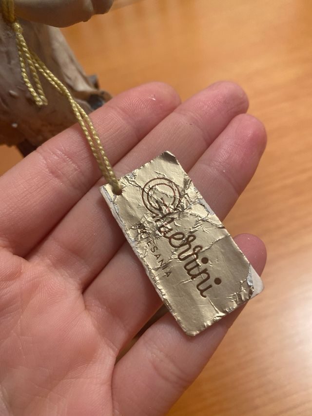 Figura artigianale Guerrini di un bambino che canta