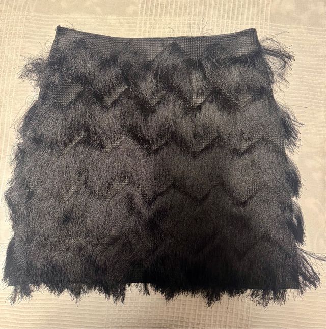Falda mini con flecos