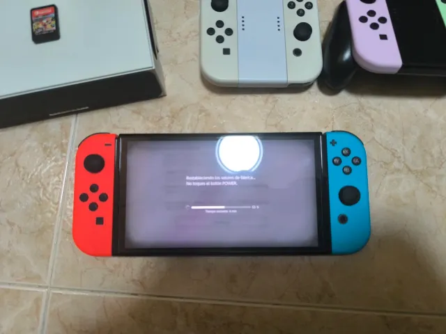 Nintendo Switch OLED + Mario Kart + 6 Joycons