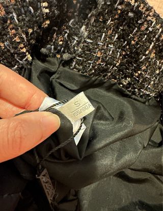 Piumino nero trapuntato con dettagli tweed