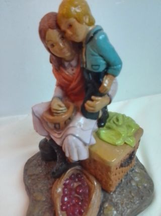 Figura antigua madre e hijo