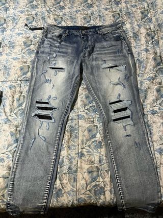 Pantalones Amiri Azules Rotos