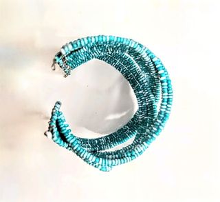 Bracciale rigido azzurro perline fatto a mano