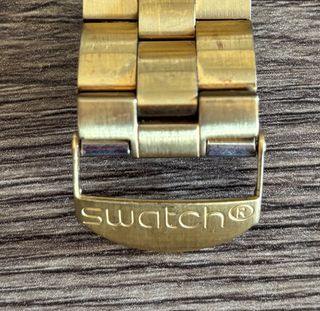 Reloj Swatch Dorado