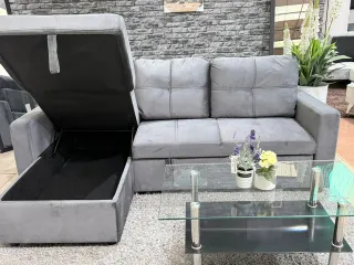 Sofá chaise longue gris con arcón