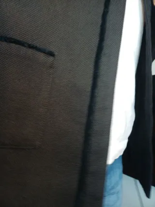 Americana negra con ribete