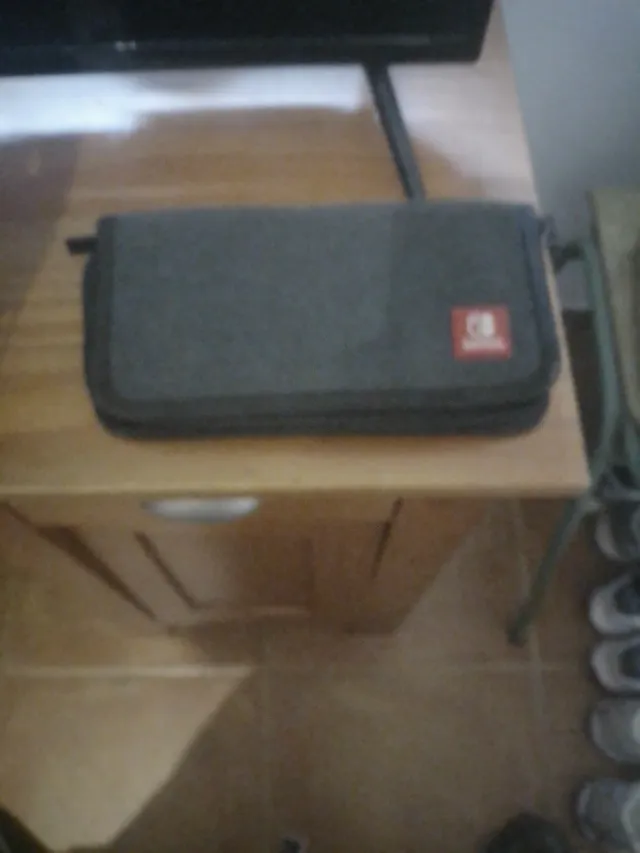 Funda para guardar nintendo suiwch y juego en ella