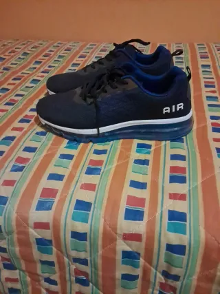 Scarpe da corsa blu e grigie