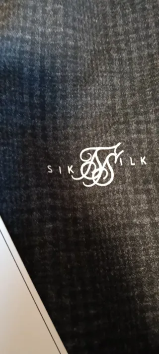 Chaqueta SikSilk gris y negra