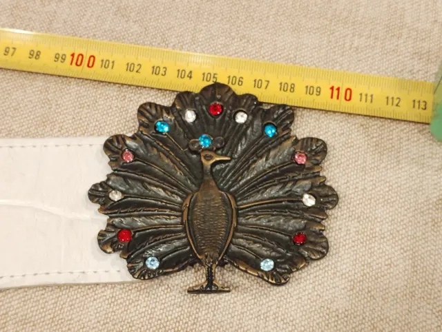 Cintura in vera pelle con fibbia pavone