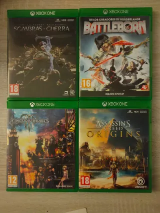 Scatoletta di quattro videogiochi per Xbox One: Shadow of War, Kingdom Hearts, Assassin's Creed e Battleborn