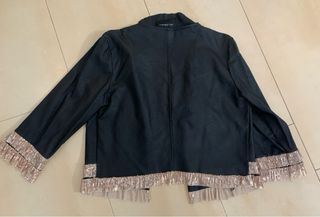 Chaqueta Niu Collection con flecos dorados