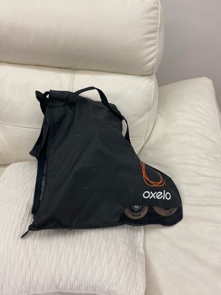 Patines niña Oxelo con funda blancos rosa y gris