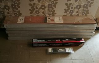 Suelo laminado,herramientas, aislante y guillotina