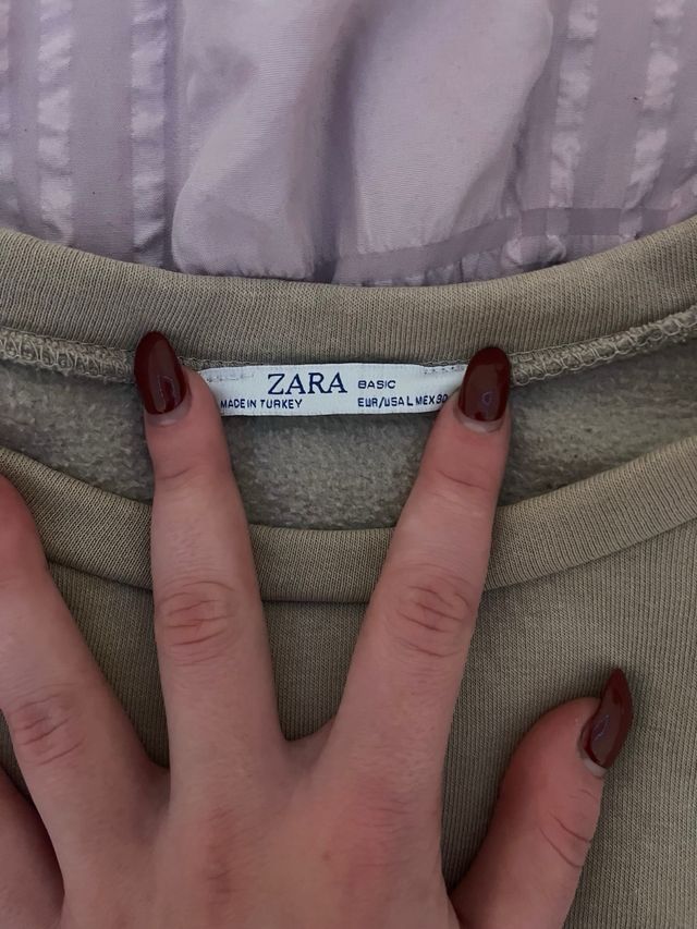 Sudadera beige con cita de Platón