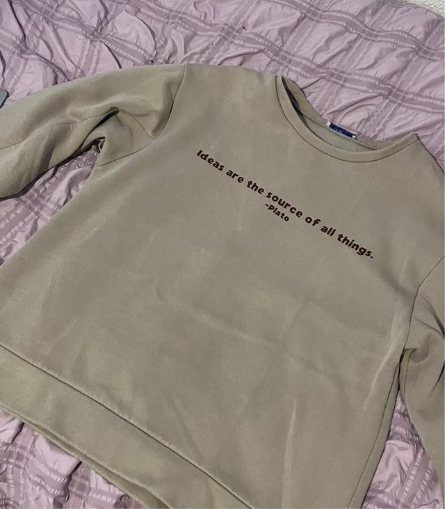 Sudadera beige con cita de Platón
