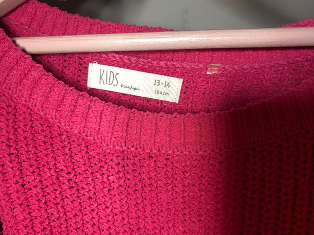 Jersey rosa fucsia con agujeros