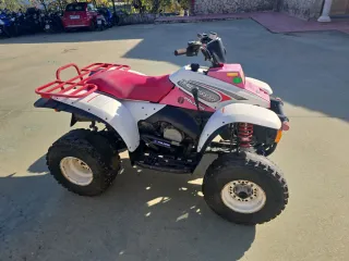 Quad Polaris Trail Boss 325 Rosa. año 2000