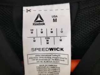 Chaqueta deportiva Reebok blanca y negra