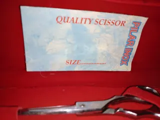 Tijeras de corte de pelo,la caja es de terciopelo