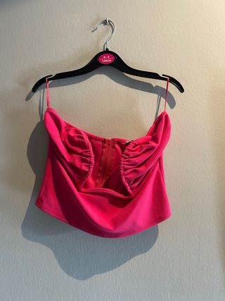 Top rosa fruncido con cremallera