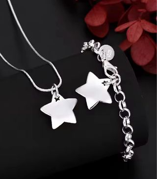 Conjunto de collar y pulsera estrella plata