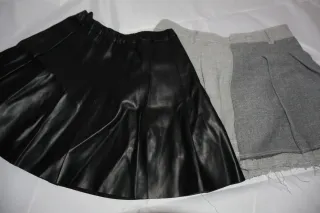 2 falda una negra polipiel y la otra gris