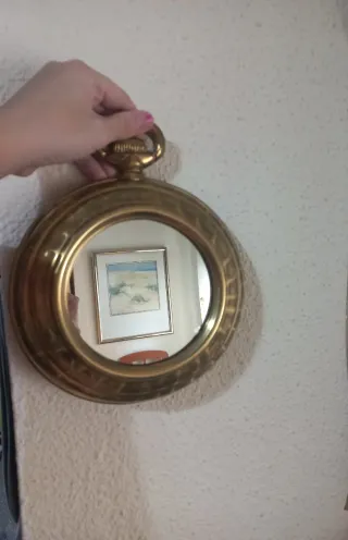 Espejo decorativo dorado estilo reloj
