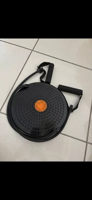 Disco giratorio con cuerdas elásticas