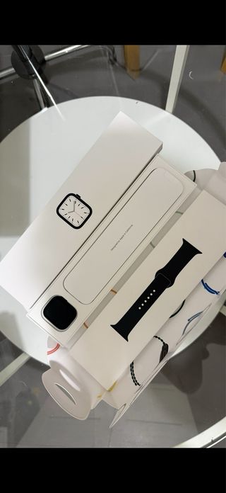 cajas, correas y cable cargador de Apple whatch