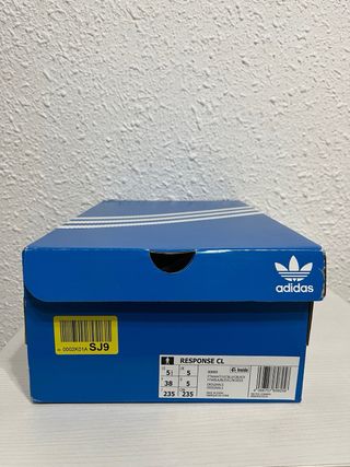 Adidas Response CL. Color blanco y beige con azul