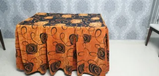 Falda mesa camilla chenilla naranja y negro