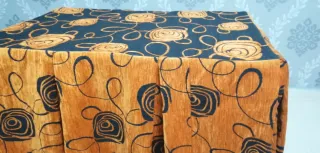 Falda mesa camilla chenilla naranja y negro