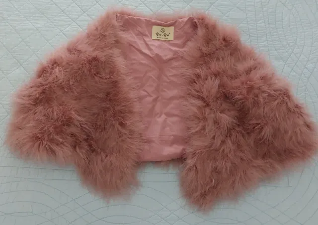 Bolero cubre hombros rosa plumeti..