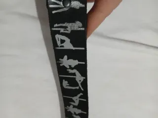 Cintura nera con figure stilizzate argento