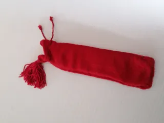 Apribottiglie dorato con sacchetto rosso