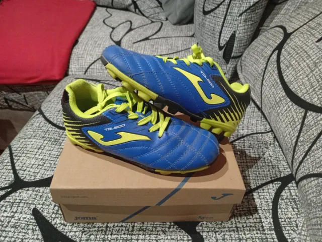 Botas de fútbol Joma niño azul y amarillo
