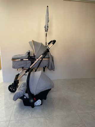 Silla de paseo 3 en 1 gris con asiento reversible.