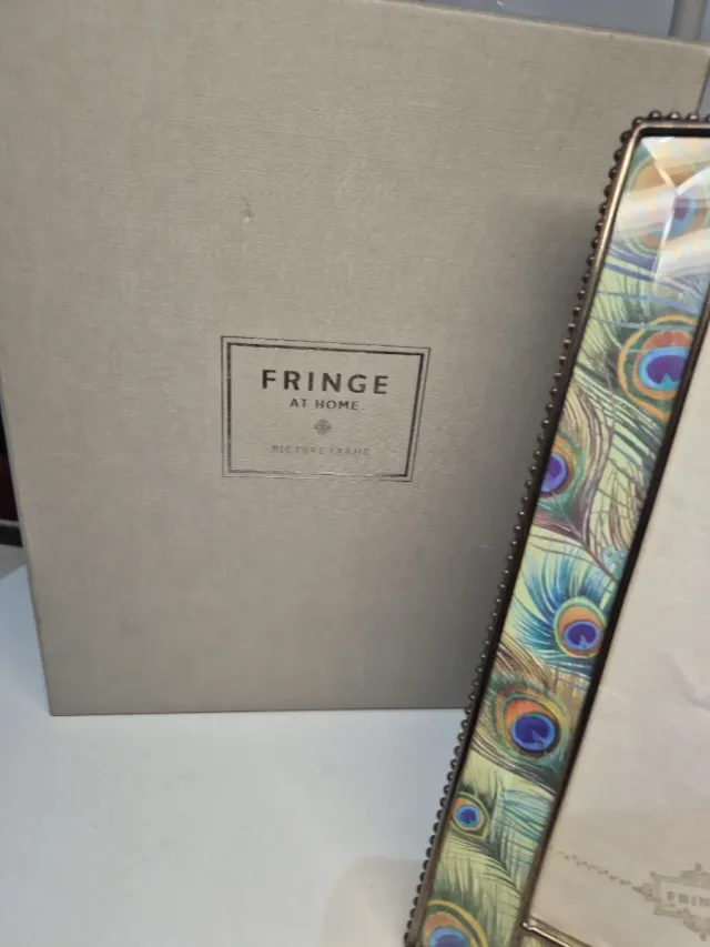 Cornice portafoto piume di pavone